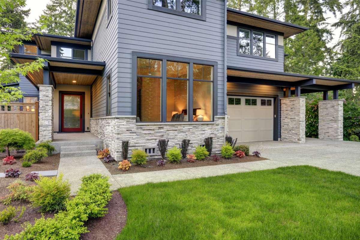 Attached versus detached ADU options for a Seattle home Modern home with a landscaped front yard, a setting where owners weigh an attached versus detached ADU
